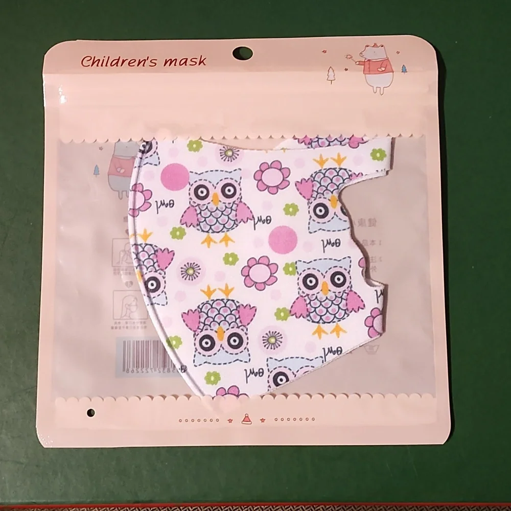 Children's re Usable face mask new in package never opened
